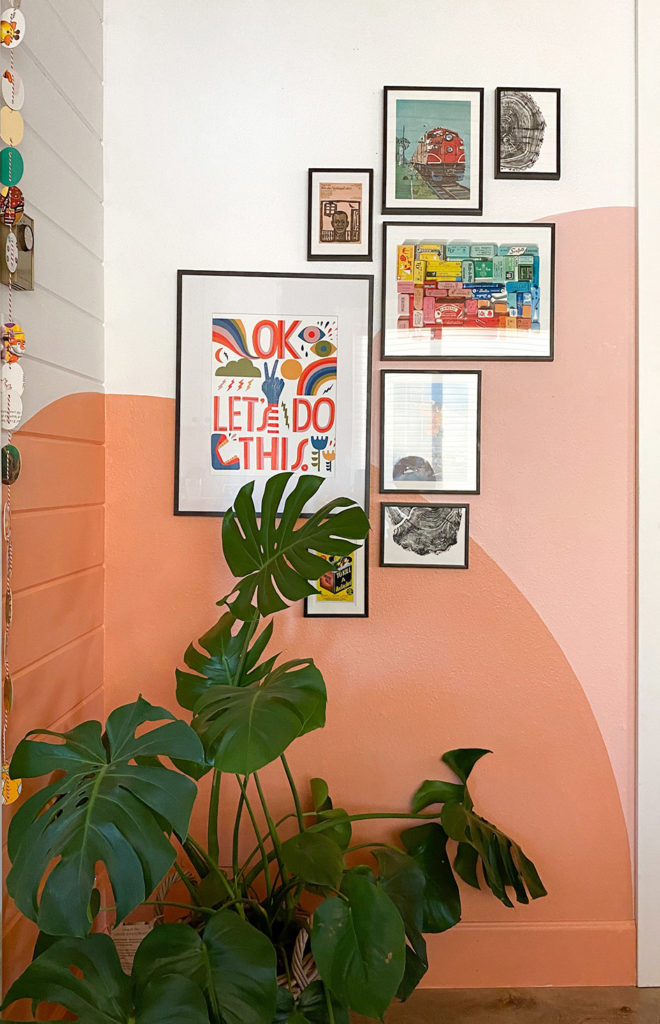 Colorful Gallery Wall with a Warm, Sunset Mural by Racheal Jackson of Banyan Bridges