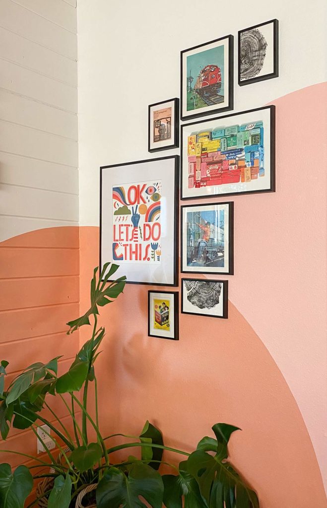 Colorful Gallery Wall with a Warm, Sunset Mural by Racheal Jackson of Banyan Bridges